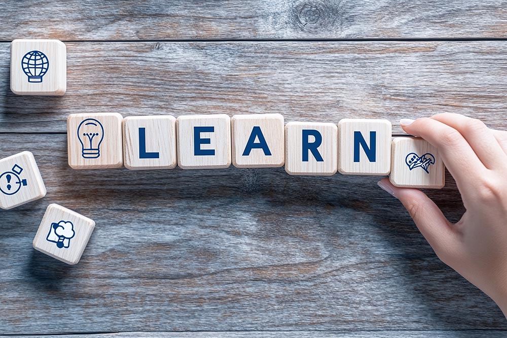 Lifelong Learning and Knowledge Acquisition: Wooden Blocks Spell